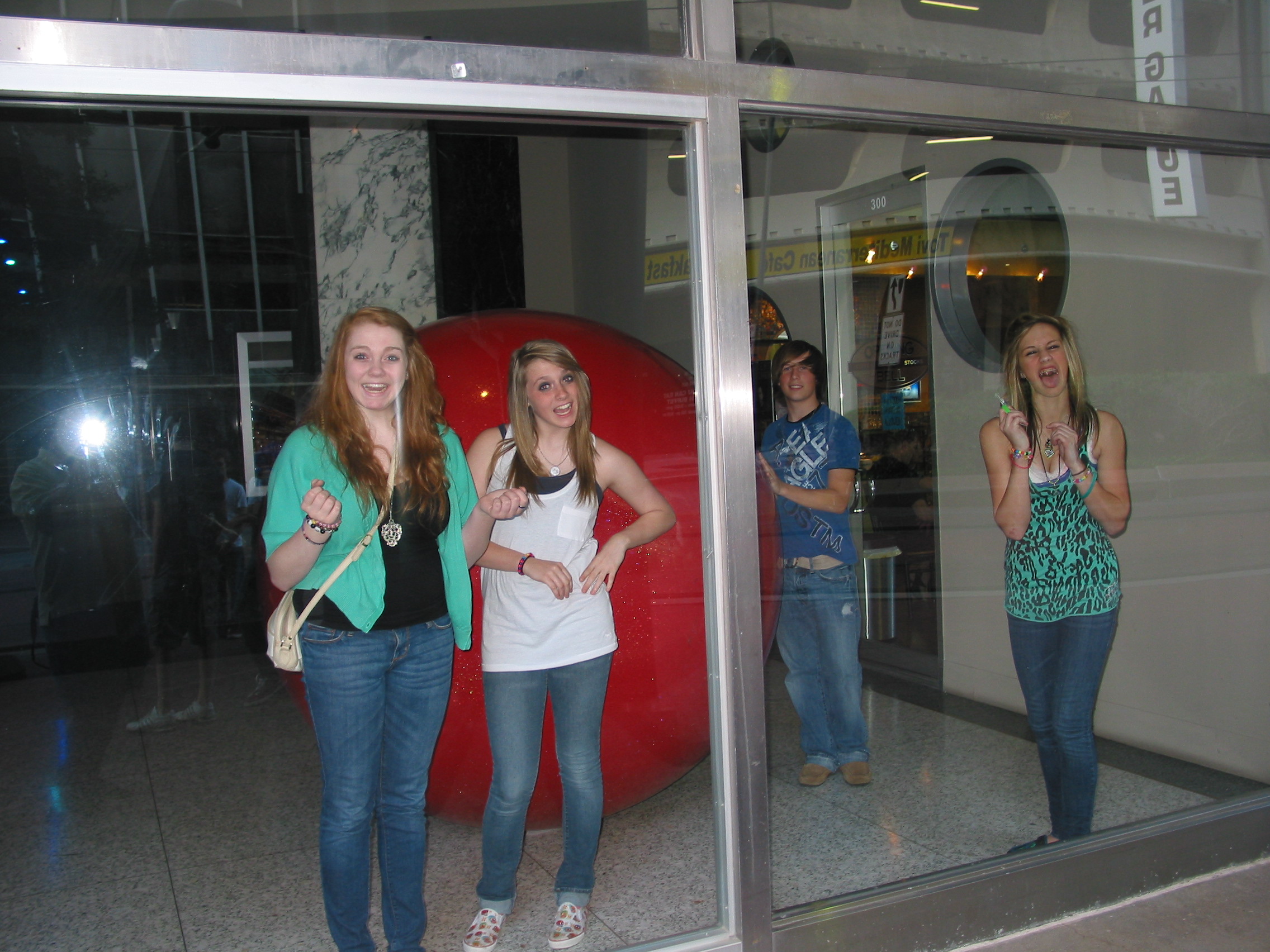 McKenzie, Logan, Justin, and Holly behind the glass